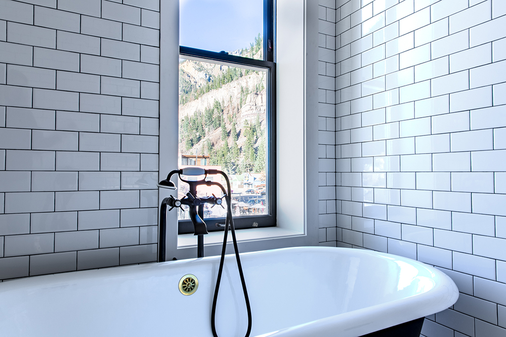 the imogene's lucky twenty room - clawfoot tub with a view of the mountains